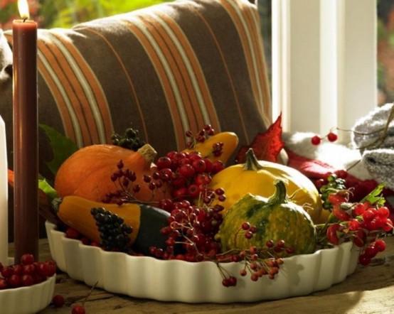 a white porcelain bowl with berries and veggies is an easy and a super natural Thanksgiving or fall centerpiece to rock