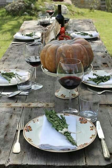 a heirloom pumpkin and greenery bunches are great for creating natural or cozy tablescapes for Thanksgiving