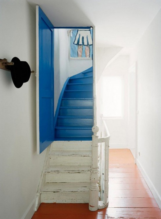 a nautical staircase with color blocking - blue and white, with a bold blue door is a lovely and shabby chic idea