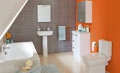 a contemporary bathroom done in neutrals and grey and spruced up with an orange statement wall for a bright touch