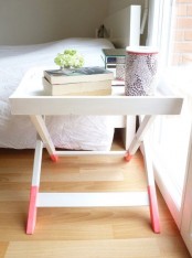 a cool nightstand – a trestle table with pink dipped legs is a lovely and fun idea for a modern bedroom with a girlish feel