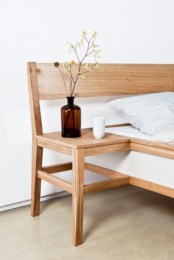 a light-stained wooden nightstand attached to the bed is a lovely idea for a modern or contemporary space, it’s a very space-saving idea