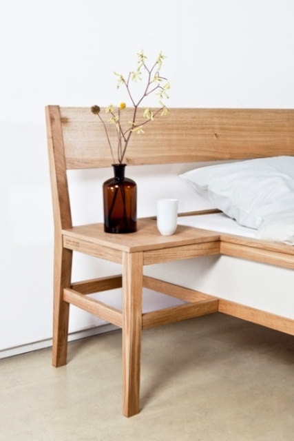 a light-stained wooden nightstand attached to the bed is a lovely idea for a modern or contemporary space, it's a very space-saving idea