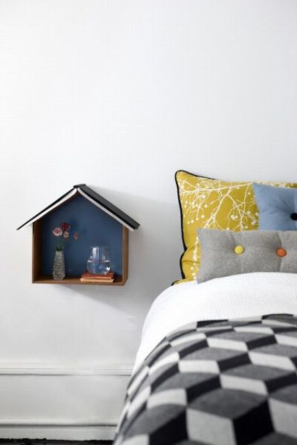 a wall mounted house shaped shelf allows to store some stuff and will be a veyr cool and creative idea for a kids' room