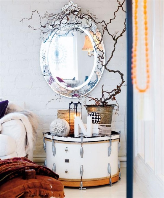 a nightstand made of a large drum, with decor, a lantern and some branches in a bucket is a lovely idea to rock in your bedroom