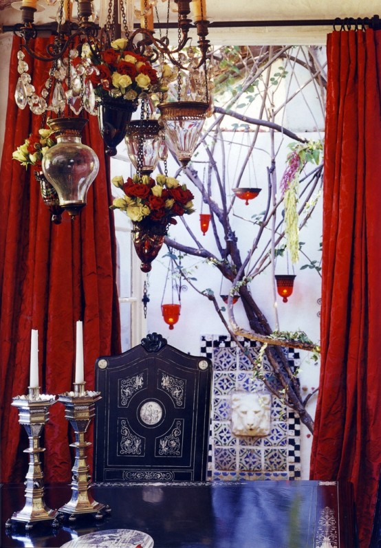 a bright dining space done with red and blues, Moroccan touches and candles