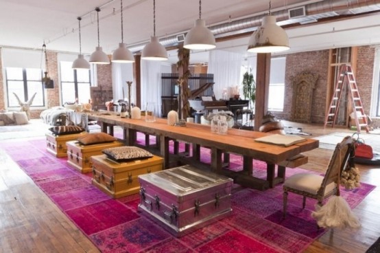 a whimsical and bright dining space with a colorful rug, metal storage pieces as seats and white shabby chic pendant lamps