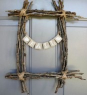 a square twig and stick wreath with a burlap bunting is a simple rustic decoration you can make yourself