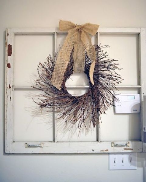 a twig wreath with a burlap bow is an easy idea to decorate your space and it looks very rustic