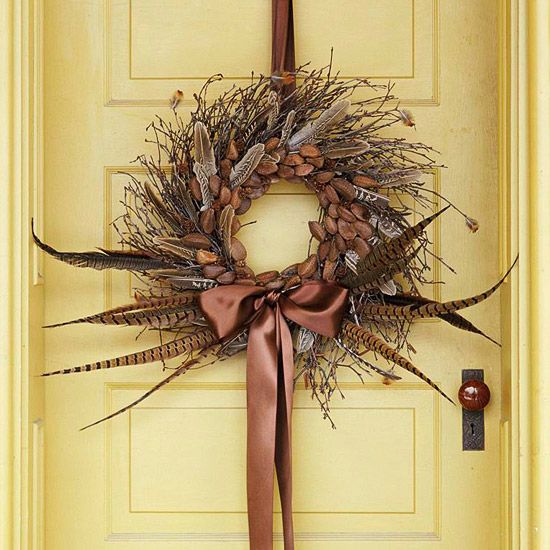 a lush twig fall wreath with nuts, acorns, feathers and a silk ribbon bow will bring a boho feel to the porch