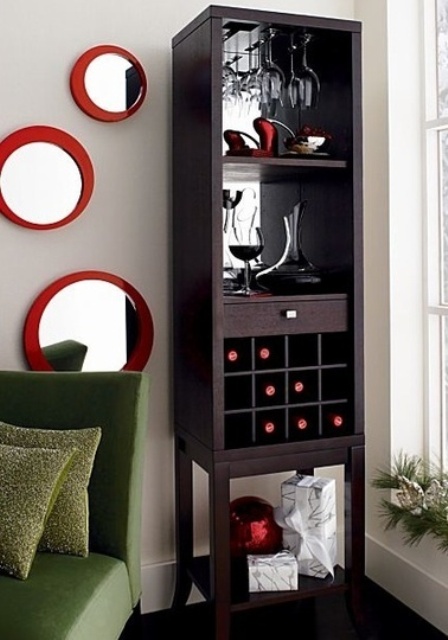 a tall dark-stained home bar is a great idea to save floor space, mirror open compartments, drawers and a wine bottle storage unit is ideal for a small space