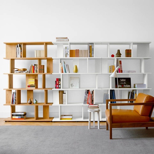 a catchy color block mid-century modenr bookcase done in white and neutral wood features a lot of storage space