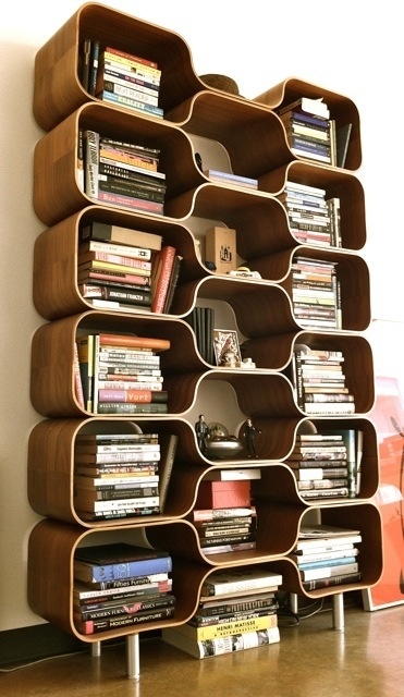 a very catchy plywood bookcase that resembles a beehive looks truly mid-century modern and bold