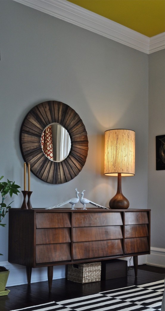 a refined dark-stained sideboard with eye-catchy covered drawers is a stylish idea for a refined living room or entryway