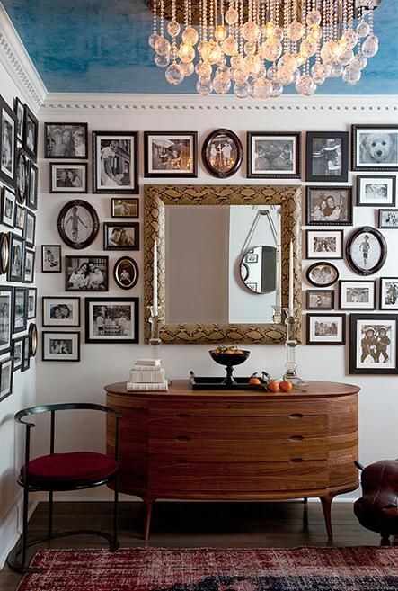 a rounded rich-stained sideboard with drawers with cutout handles is a lovely item for a chic mid-century modern space, and its shape will give your room a twist