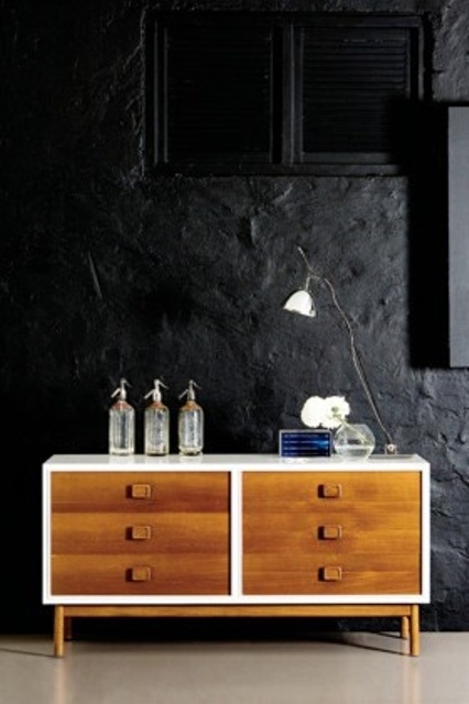 a stylish mid-century modern sideboard in white, with stained drawers and legs is a cool idea for any mid-century modern space