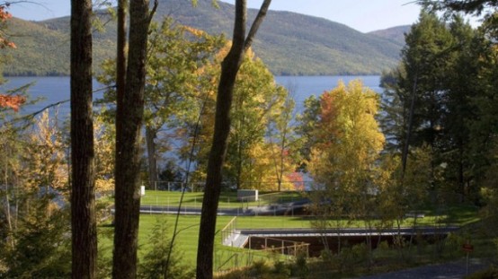 Partially Buried Lake House With Nature Let In