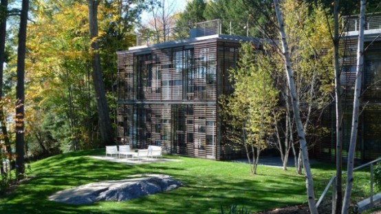 Partially Buried Lake House With Nature Let In