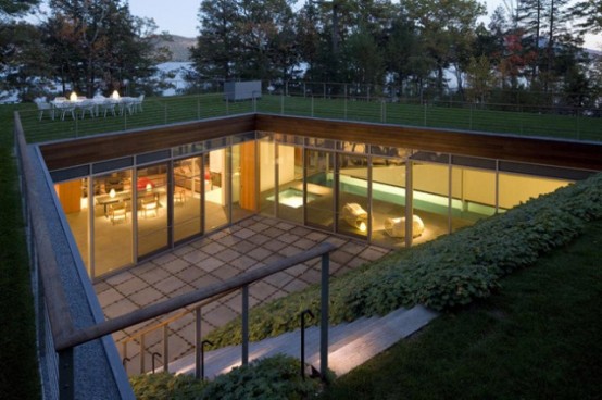 Partially Buried Lake House With Nature Let In