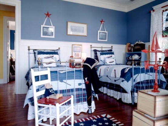 Patriotic shared bedroom in different shades of blue and traditional beds.