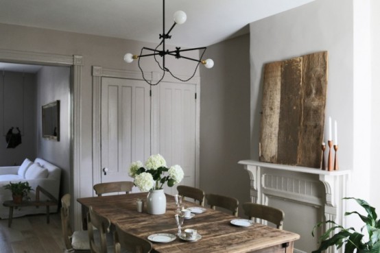 Peaceful Dining Room With Farmhouse Furniture And Industrial Lights