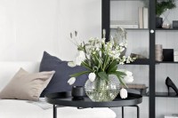 a sheer vase with white blooms is all you need to bring a fresh feel to your Nordic space