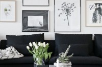a sheer vase with white tulips, a wrapped planter with succulents and a candle for refreshing this bold black and white Nordic space