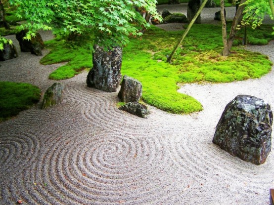 Adding an area with raked sand to your garden is a great way to represent water ripples. The cool thing about it that you can change it whatever you want.