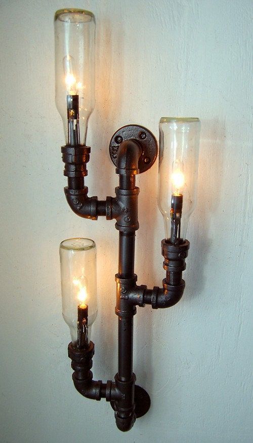 a pipe and bulb wall sconce is a unique and bold solution for an industrial room, it looks cool and unusual