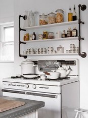 an exposed pipe kitchen rack in black and white is a cool idea for a kitchen, you can DIY it and paint the colors that you like
