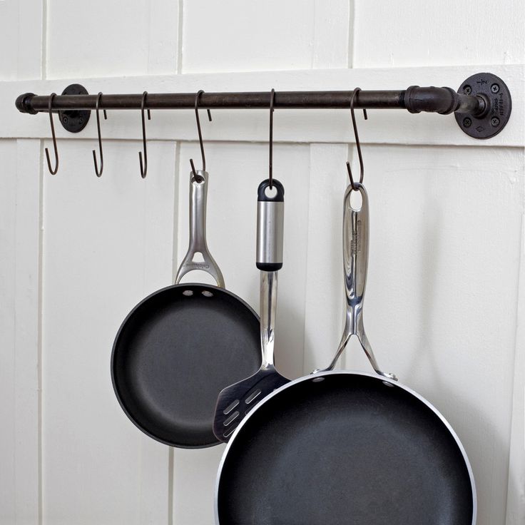 a black pipe rack like this one for a kitchen is a cool and smart idea to try, you can make such racks in other spaces, too