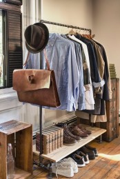 a stylish and laconic exposed pipe clothes and shoe rack with several tiers is a lovely idea for a masculine or industrial space