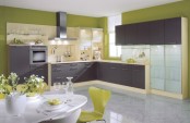 a colorful ktichen with lime green walls, dark grey cabinets, neutral touches and much light is bold