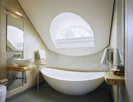 a whimsy attic bathroom with a catchy window, a wooden vanity and a vessel sink