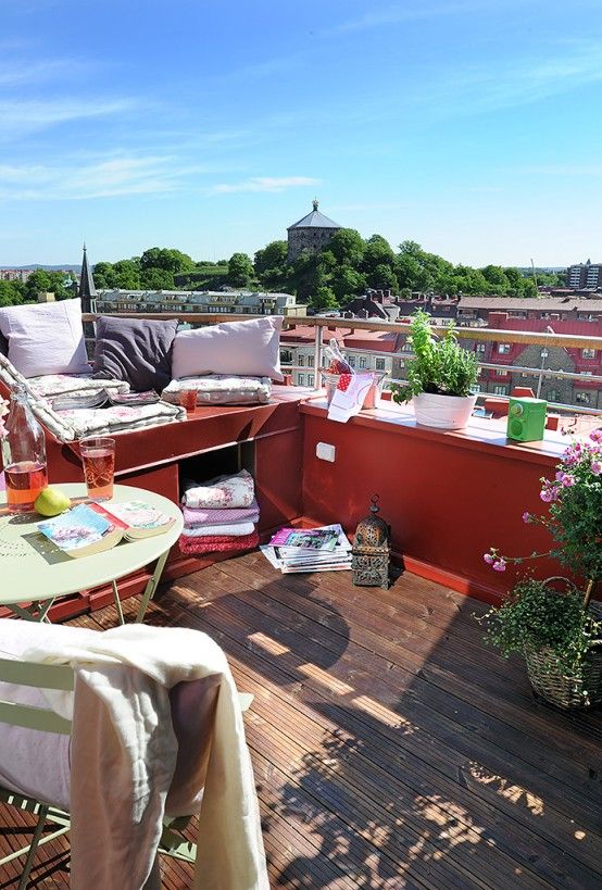 a large metal platform that acts as a storage piece and a daybed and a storage piece next to it