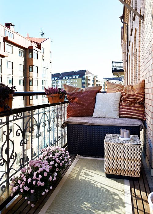 a large wicker chest features a storage space and acts as a seat