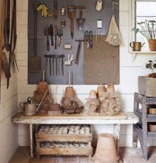 a large grey pegboard allows you attaching hooks, hanging stuff and items for storage