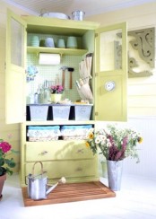 a vintage wardrobe renovated with bright paint will be a nice garden she storage unit, add pegboard inside, too
