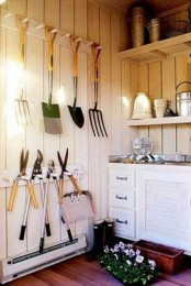 hooks on the wall next to your usual cabinets and shelves are a great and comfortable idea
