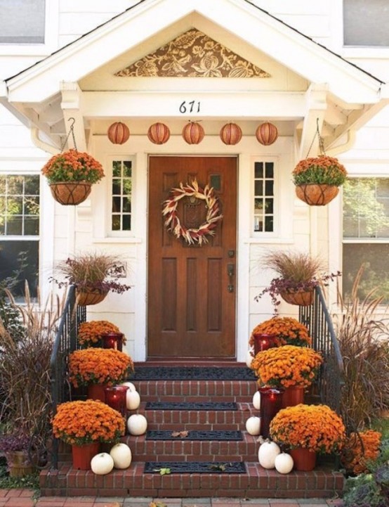 Plant seasonal flowers in planters and arrange them on your steps.