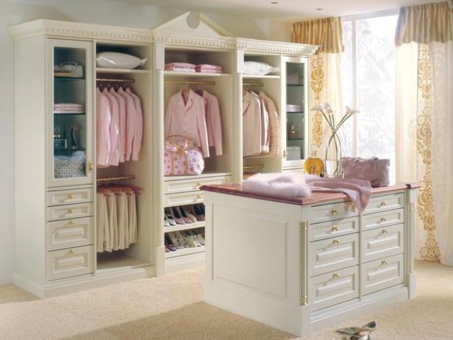 a simple feminine closet with an open and glass storage wardrobe, with drawers and a matching storage cabinets for small accessories and other stuff