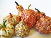 pumpkins and gourds decoupaged with bright fall leaves and blooms look fun and very out of the box