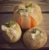 wrap some real pumpkins with burlap and add a lace bow on top to make them look stylish and very rustic