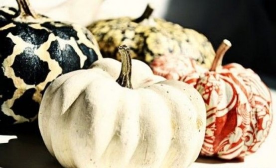 mini pumpkins with bright patterns, swirls in various fall colors are a cool DIY to go for