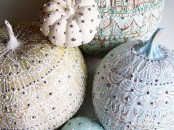 pastel and neutral pumpkins decorated with beautiful paint patterns and silver beads are a very delicate and chic idea for fall or Halloween decor