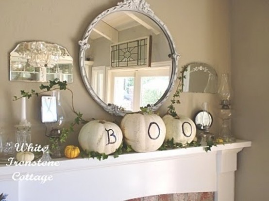 white pumpkins with black letters are amazing to style your mantel for Halloween and are very easy to make