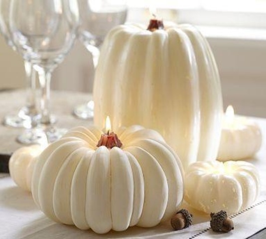 white pumpkin candles are perfect decorations of Halloween and will make your tablescape cozier and more inviting