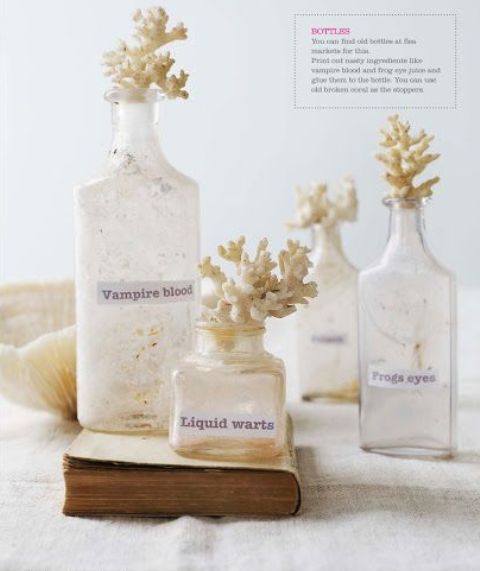 white bottles with scary labels and some corals on top are an easy and fast to make DIY decoration for Halloween