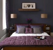 a purple accent wall, a purple floral curtain, wooden furniture, purple and leopard print bedding and chic pendant lamps