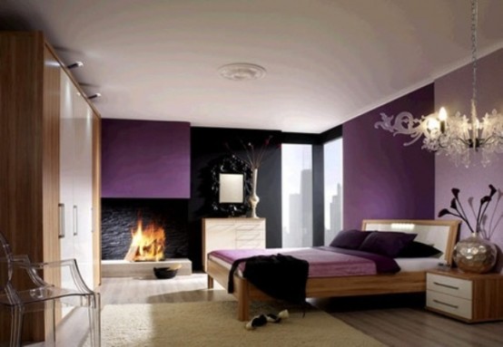 a refined bedroom with a purple color block wall, a purple hood and bedding, a black stone wall and a mirror in a black frame